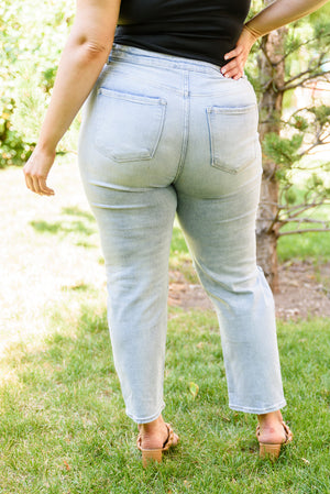 Risen High Waist Light Wash Distressed Jeans